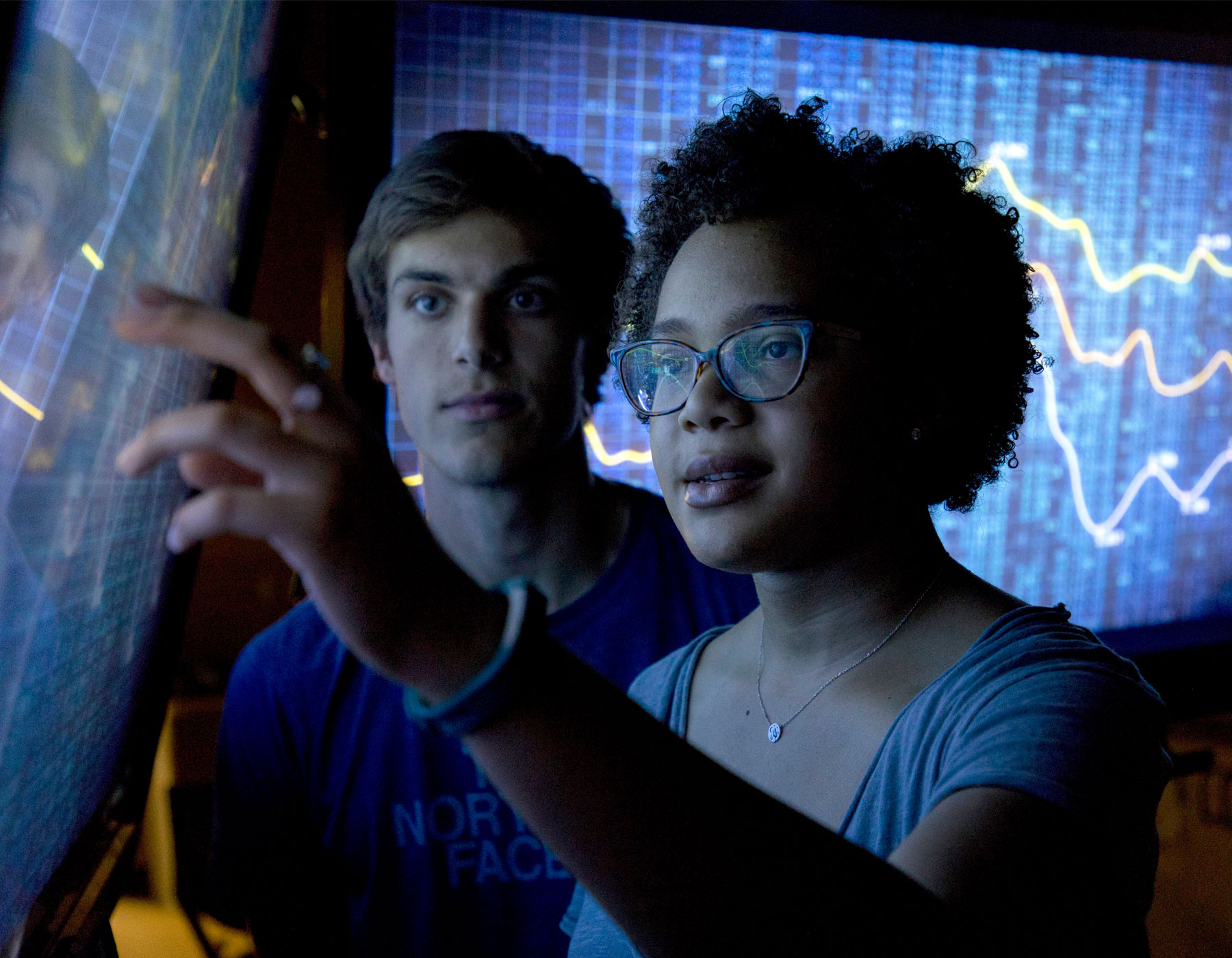 Two students observing visual analytics