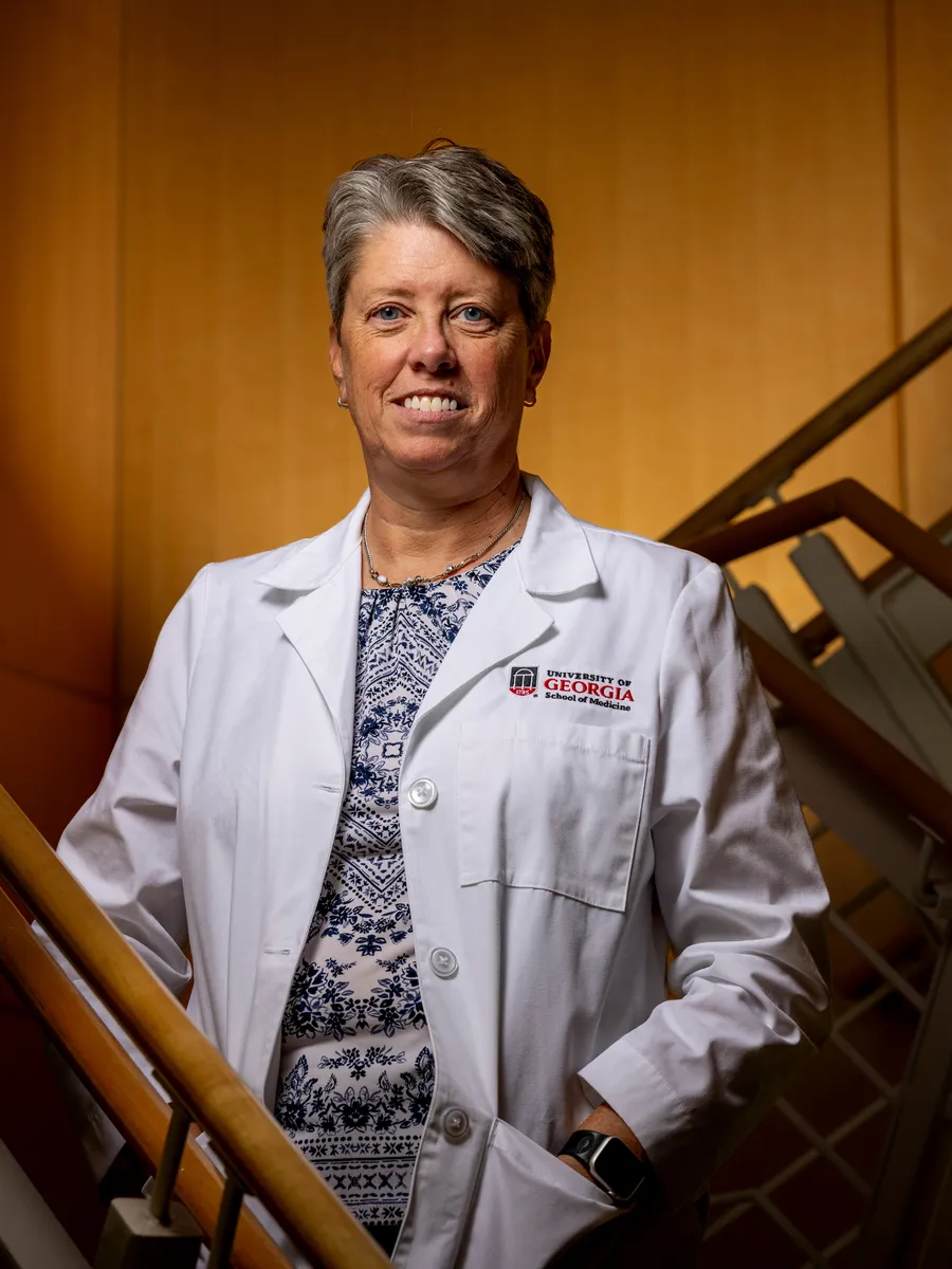 Shelley Nuss standing on a staircase