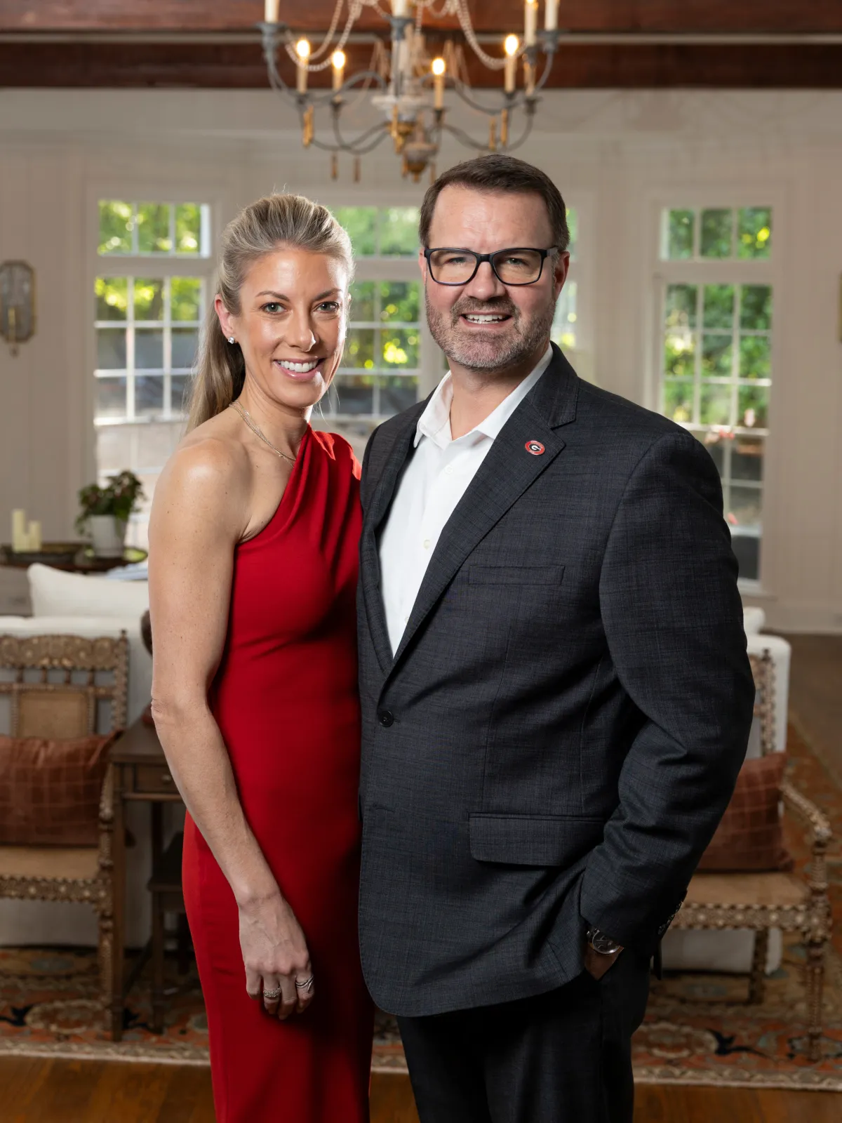 Carrie and Paton Faletti stand together in their living room